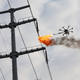 Electric company maintenance workers in Xiangyang, China used a fire-shooting drone to burn garbage from electrical wires (Photo by Wang Hu/VCG)